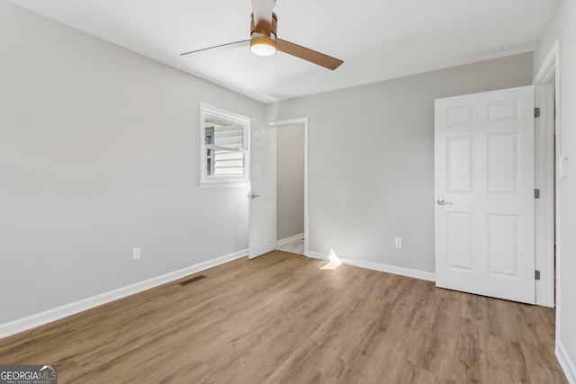 unfurnished bedroom with light hardwood / wood-style floors and ceiling fan