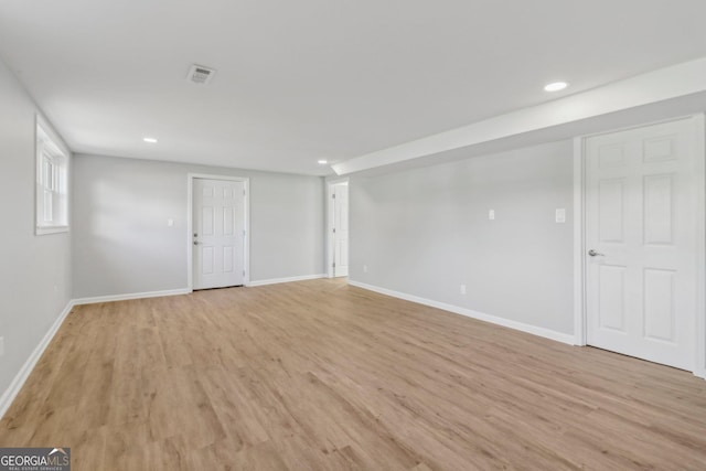 spare room with light hardwood / wood-style flooring