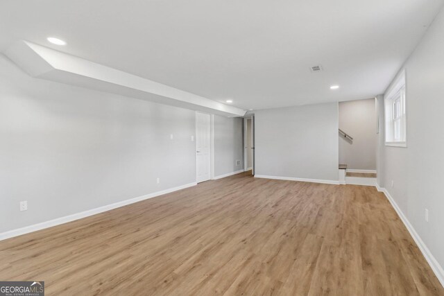 basement featuring light wood-type flooring