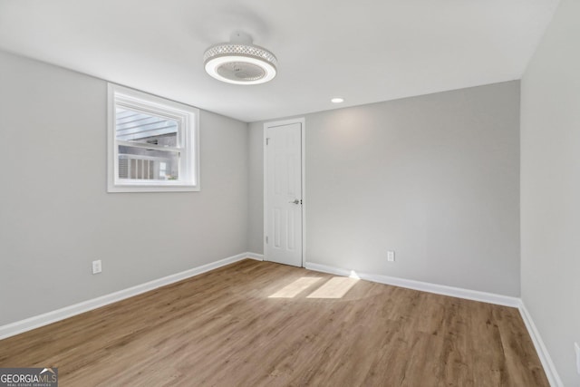 unfurnished room with light hardwood / wood-style floors