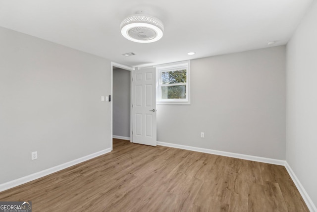 empty room with light hardwood / wood-style floors