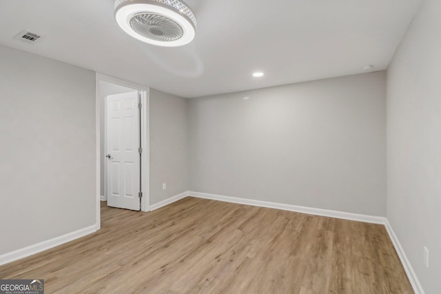 spare room featuring light hardwood / wood-style flooring