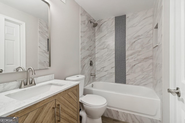 full bathroom with vanity, toilet, and tiled shower / bath combo