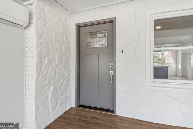 property entrance with a wall mounted air conditioner