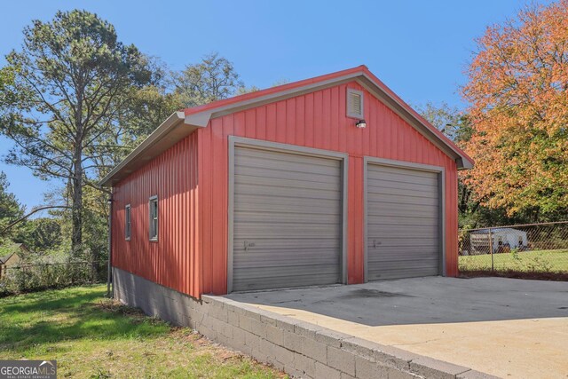 garage with a lawn