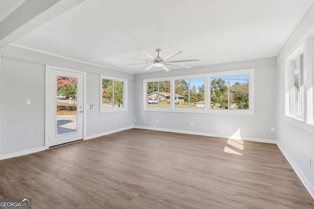 unfurnished room featuring hardwood / wood-style floors and ceiling fan