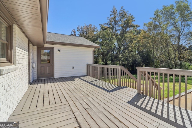 deck featuring a lawn