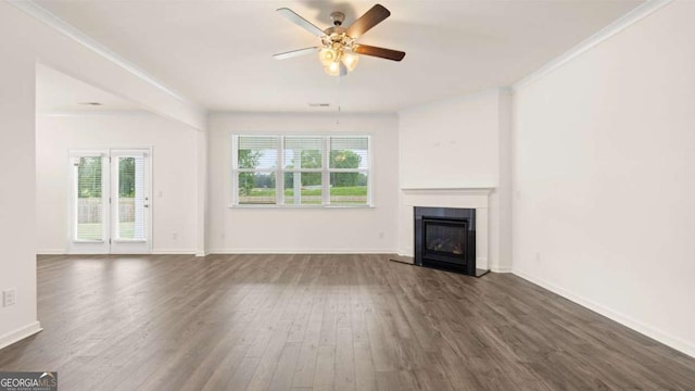 unfurnished living room featuring ceiling fan, dark hardwood / wood-style floors, and ornamental molding