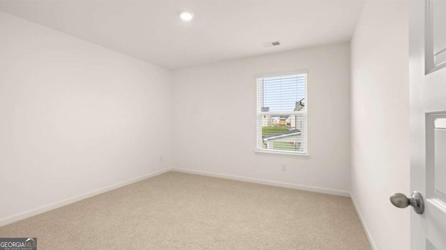 empty room featuring carpet flooring