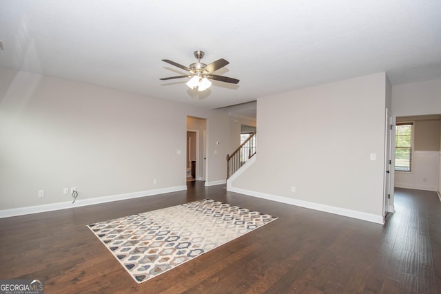 spare room with ceiling fan and dark hardwood / wood-style flooring