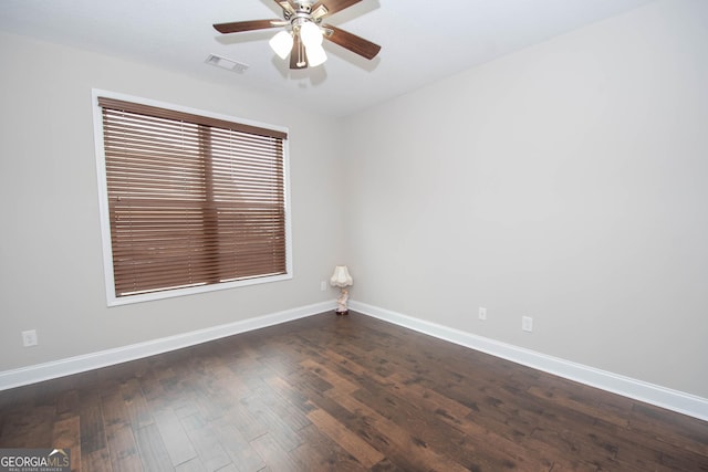 unfurnished room featuring dark hardwood / wood-style floors and ceiling fan