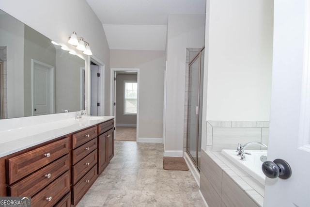 bathroom featuring vanity, lofted ceiling, and plus walk in shower