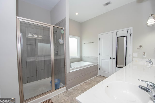 bathroom with separate shower and tub and vanity