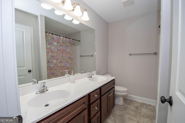 bathroom with vanity and toilet