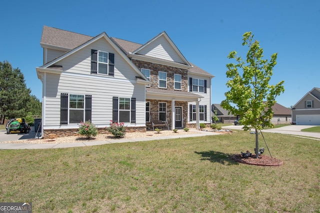 colonial-style house with a front yard