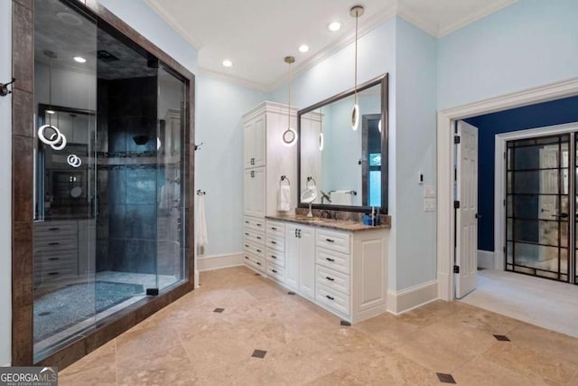 bathroom featuring vanity, a shower with shower door, and ornamental molding