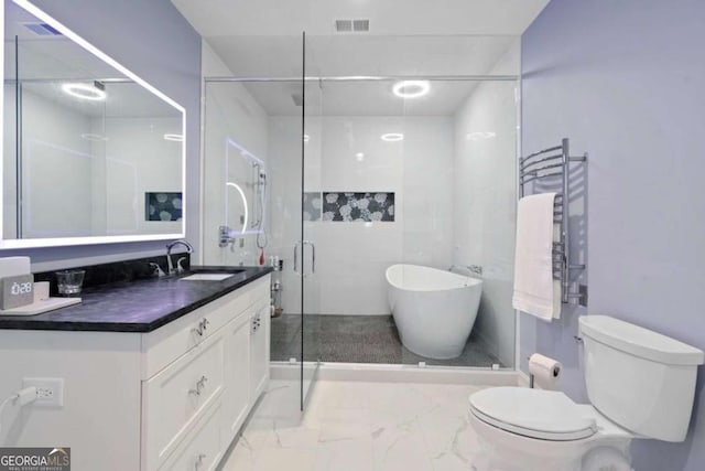 bathroom with vanity, toilet, walk in shower, and radiator