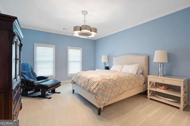 carpeted bedroom with ceiling fan and crown molding