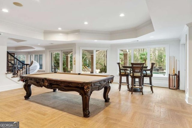 rec room featuring light parquet floors, crown molding, billiards, and a tray ceiling