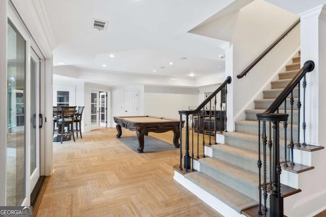 playroom featuring french doors, light parquet flooring, crown molding, and pool table