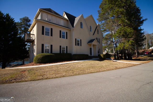 view of front of house with a balcony