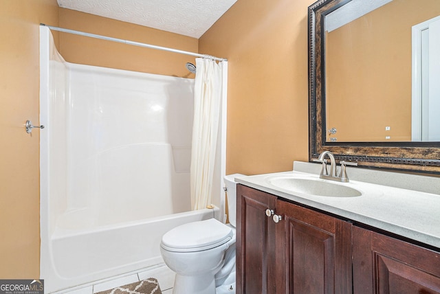 full bathroom with vanity, tile patterned floors, shower / bath combination with curtain, toilet, and a textured ceiling