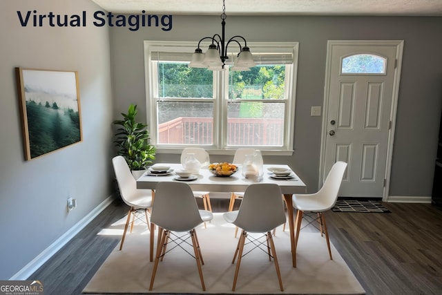 dining area featuring a chandelier and dark hardwood / wood-style floors