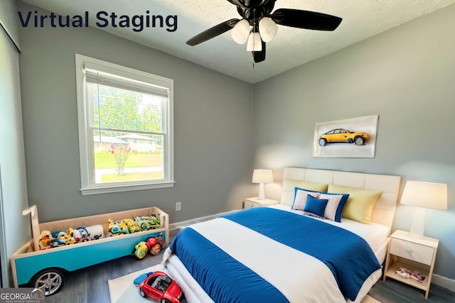 bedroom with hardwood / wood-style flooring and ceiling fan