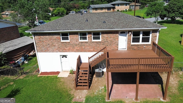 rear view of house with central AC unit and a deck