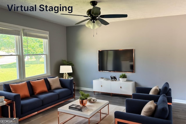 living room featuring ceiling fan and hardwood / wood-style flooring