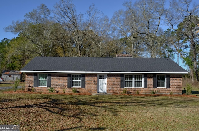 ranch-style house featuring a front lawn