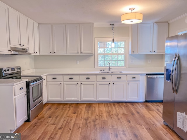 kitchen with sink, stainless steel appliances, and white cabinetry