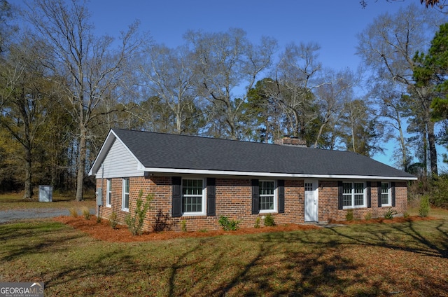 ranch-style home with a front yard