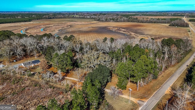 birds eye view of property with a rural view