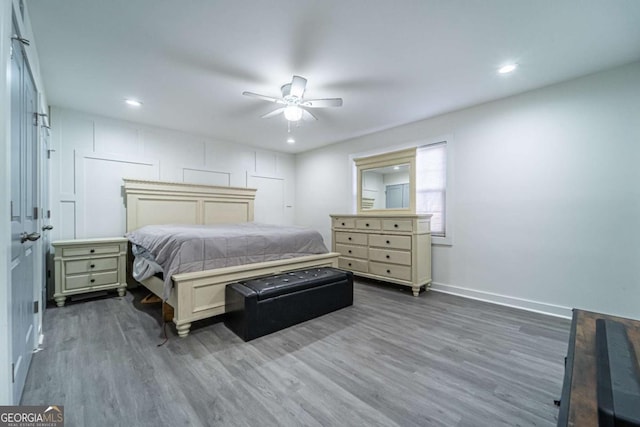 bedroom featuring ceiling fan and dark hardwood / wood-style floors