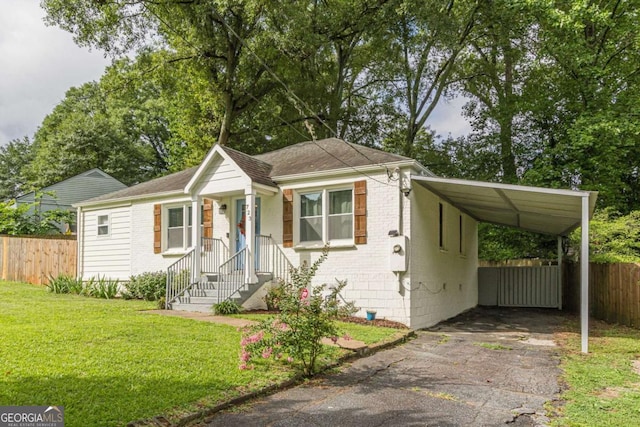 bungalow-style home featuring a carport and a front lawn