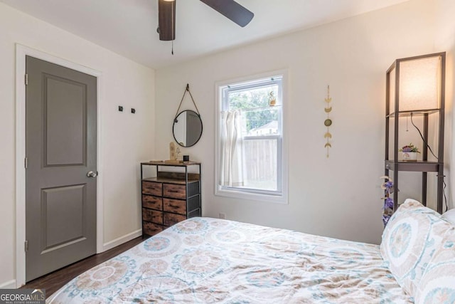 bedroom featuring dark hardwood / wood-style flooring and ceiling fan