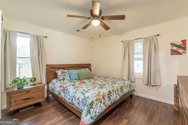 bedroom featuring ceiling fan and dark hardwood / wood-style flooring