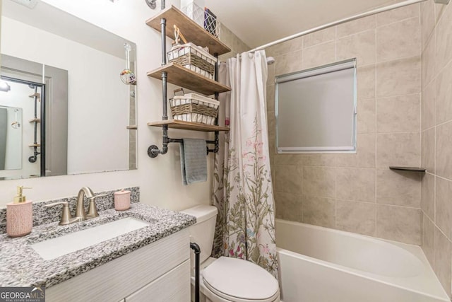 full bathroom featuring vanity, toilet, and shower / tub combo with curtain