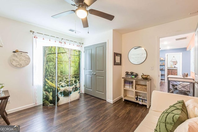 interior space featuring dark hardwood / wood-style flooring and ceiling fan