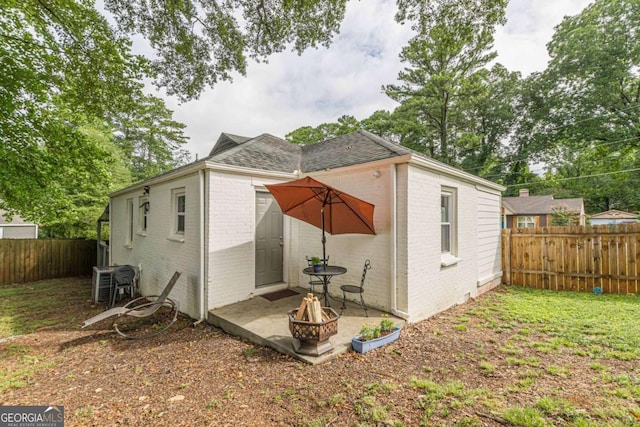 back of property with a patio area