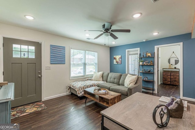 living room with dark hardwood / wood-style floors and ceiling fan