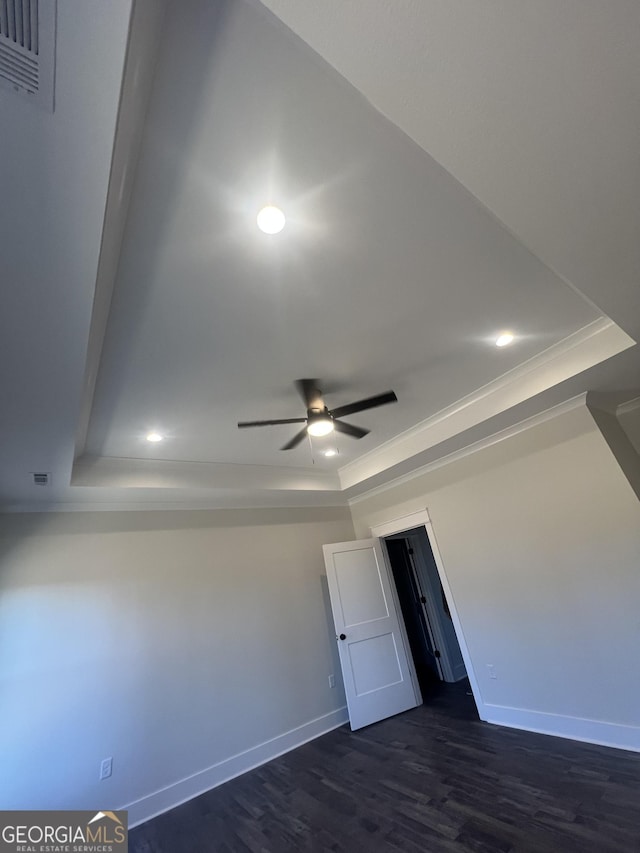 interior space with dark hardwood / wood-style flooring and ceiling fan