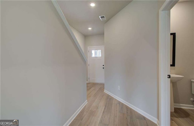 corridor featuring light wood-type flooring