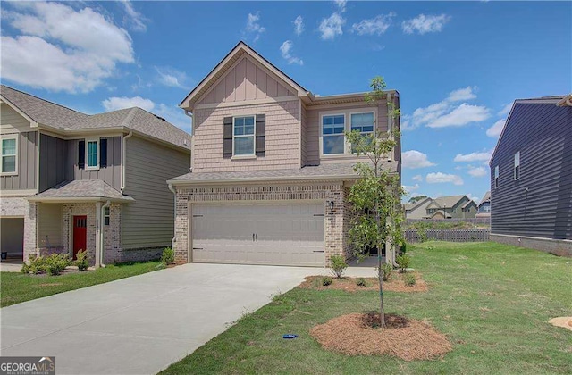 view of front of home featuring a front yard and a garage