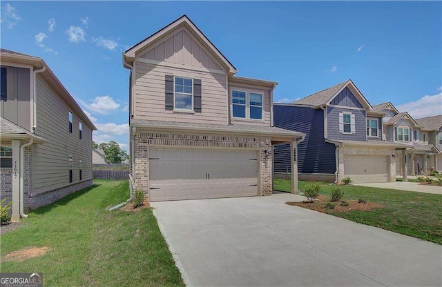 view of front of house featuring a front yard and a garage