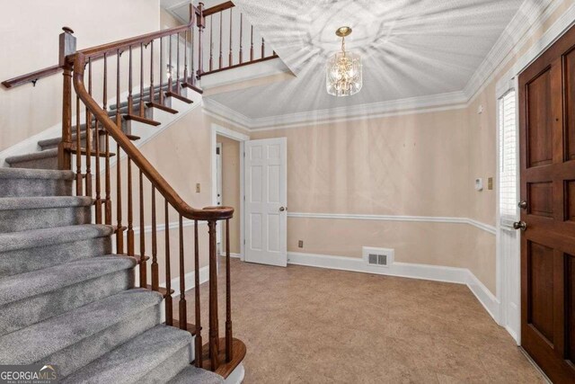 corridor with carpet flooring, a textured ceiling, a chandelier, and ornamental molding