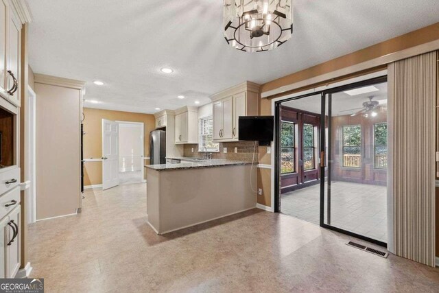 unfurnished living room with high vaulted ceiling, light colored carpet, beam ceiling, and ceiling fan