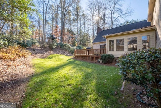 view of yard featuring a deck