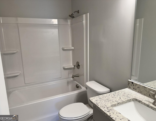 full bathroom featuring bathtub / shower combination, vanity, and toilet